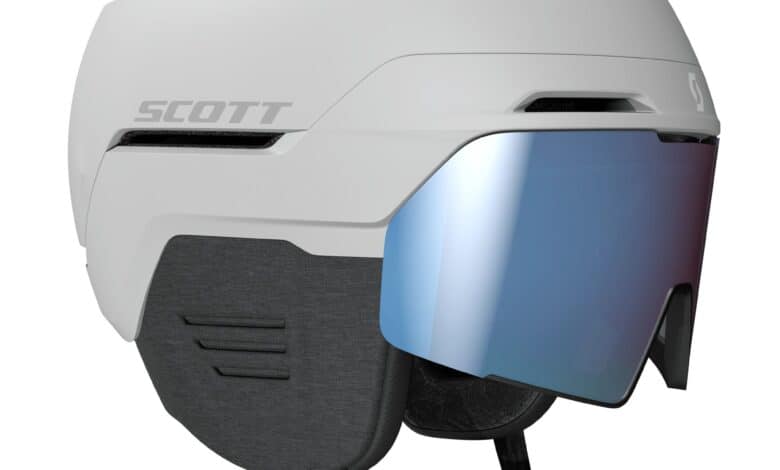 Advanced white snow sports helmet with integrated visor, designed for winter sports enthusiasts, offering maximum safety and comfort in cold weather conditions.