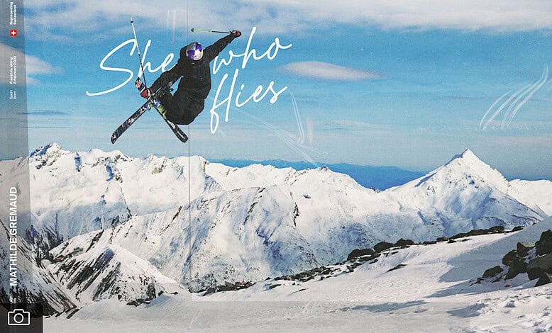 Snowboarder performing aerial jump on mountain snow peak in winter landscape, highlighting winter sports and adventure.