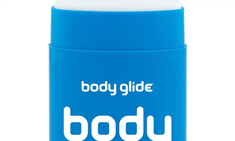 Silicone anti-chafe balm in blue container, body glide brand, designed for smooth skin protection during winter activities or sports. Compact, portable, perfect for winter skin care.