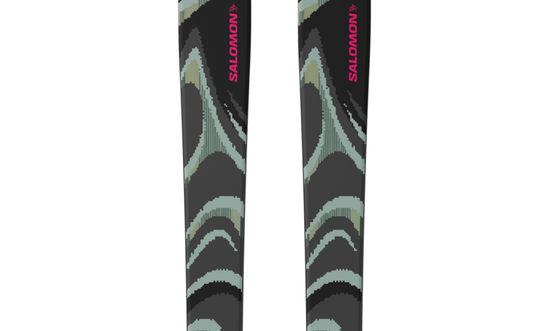 Pair of Salomon snow skis with a black, grey, and pink design, ideal for winter skiing adventures.