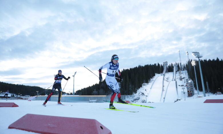 Cross-country skiers racing on a snowy Nordic course