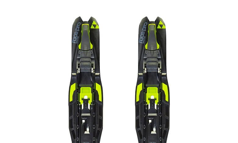 Pair of black and neon yellow ski bindings designed for winter skiing and snowboarding, featuring adjustable straps and durable construction.