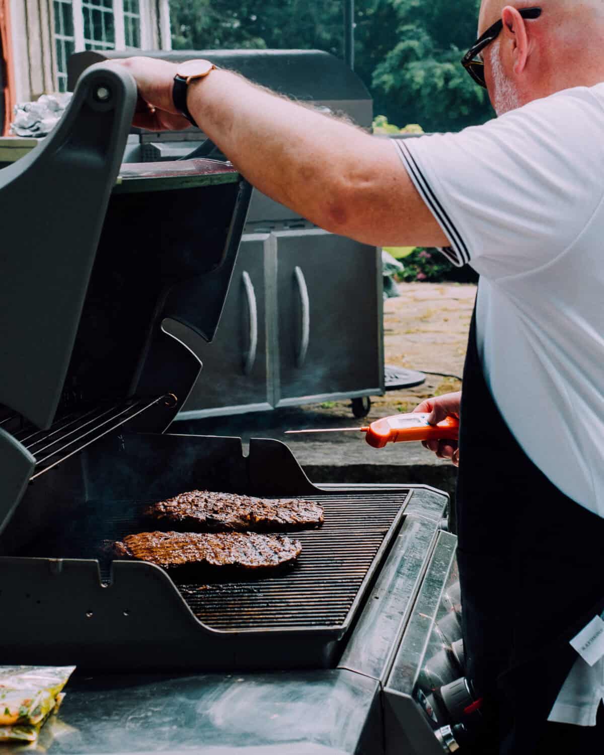 Grill the steak turning once 90° on each side until lightly charred and an instant-read thermometer inserted in the thickest part registers 125°, 10 to 12 minutes.