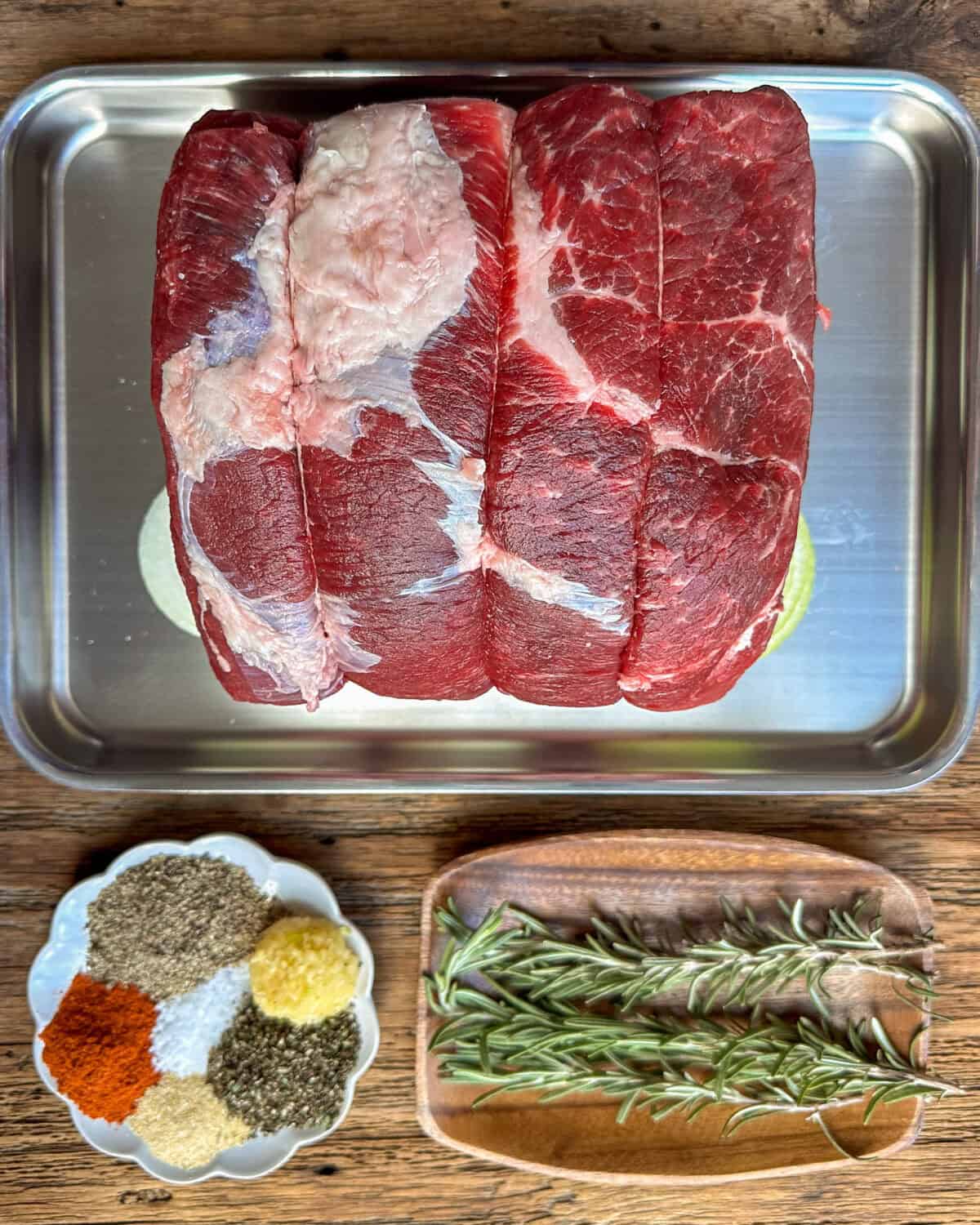 Roast beef and rub spices for grilling.