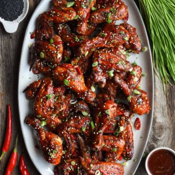 A platter of Grilled Chicken Wings & Drums with a spicy Korean BBQ Sauce