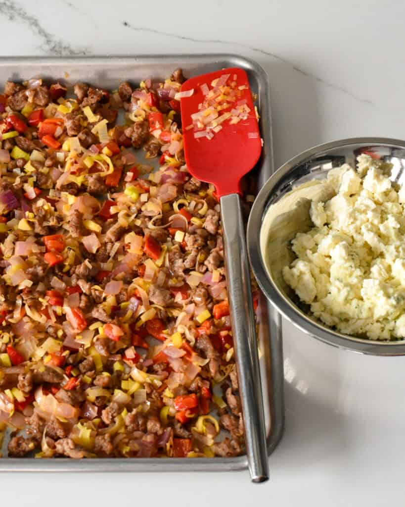 Combine sausage and vegetable mixture.