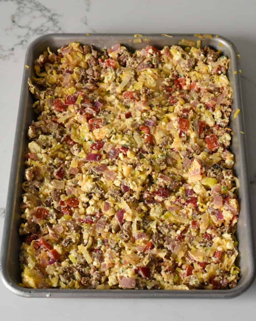 Combine the sausage and vegetable mixture with the eggs.