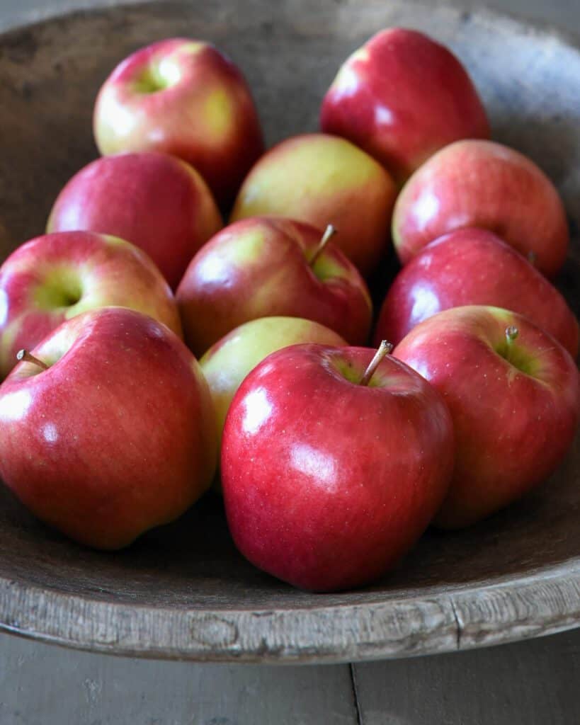 Apples in a bowl, ready to be used in a cedar planked salmon dish.