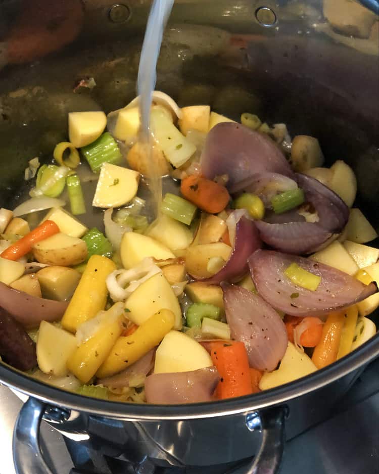 Sauté vegetables in a stock pot.