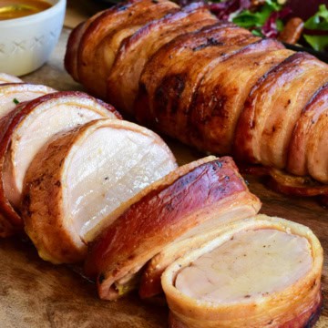 Sliced pork tenderloin wrapped in bacon.