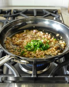 Sauté shallots and onions in butter.