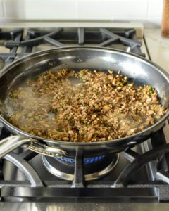 Sautéing mushrooms in a skillet
