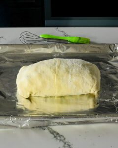 Gently turn over, wrapping dough around underside and ends of tenderloin to fully enclose.