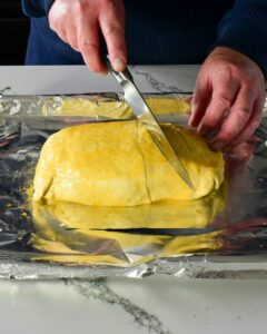 Beef wellington pictures. Cut 3 slits across the top of pastry to allow steam to escape while baking; brush all over with beaten egg.