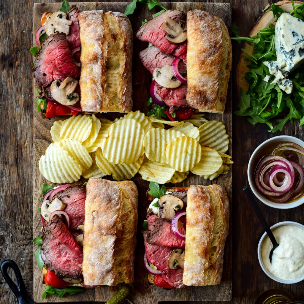 Four Ultimate Roast Beef Sandwiches served with ripple chips.