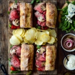 Four Ultimate Roast Beef Sandwiches served with ripple chips.