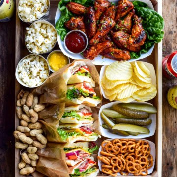 An assortment of game day snacks on a tray.