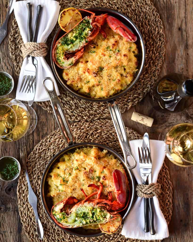 Grilled Lobster Mac and Cheese served in separate skillets.