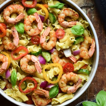 A close-up image of a Wild Argentinian Shrimp Pesto Pasta Salad.