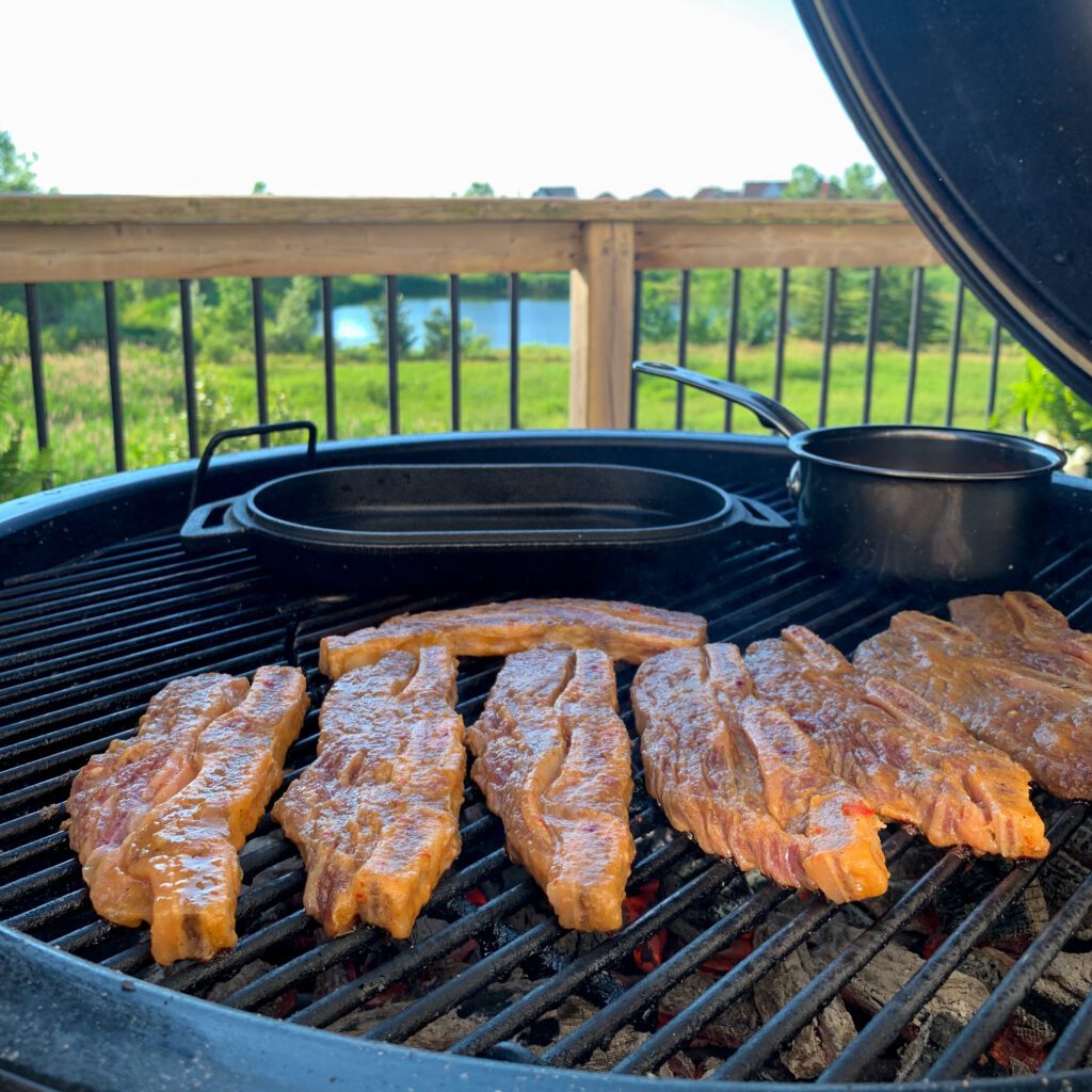 Marinated beef short ribs on the grill.