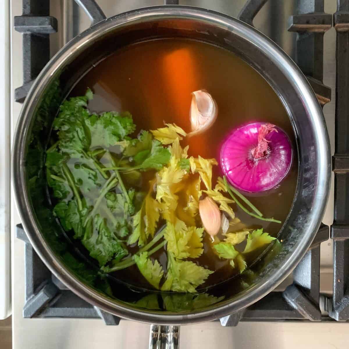 I use to vegetable scraps to flavour the broth are typically the last rubbery carrot in the bag, the hearts of an old celery, halves of onions sitting in the fridge, that I keep around to flavour stocks.