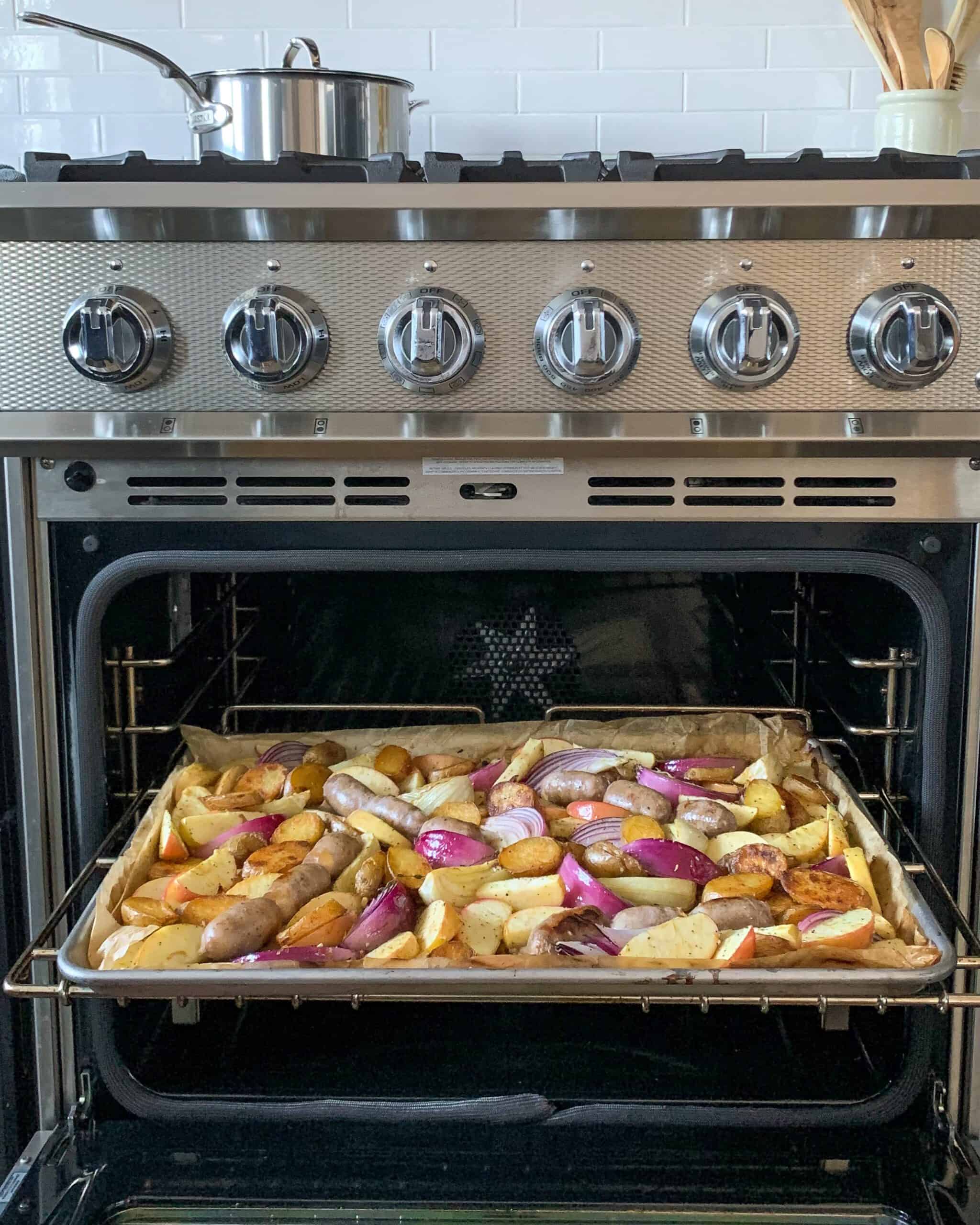 A sheet pan coming out of the oven.