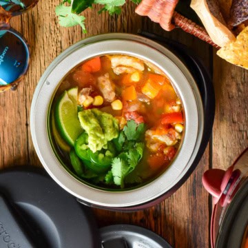 A bowl of Fiesta Chicken Chili in a small portable crockpot.