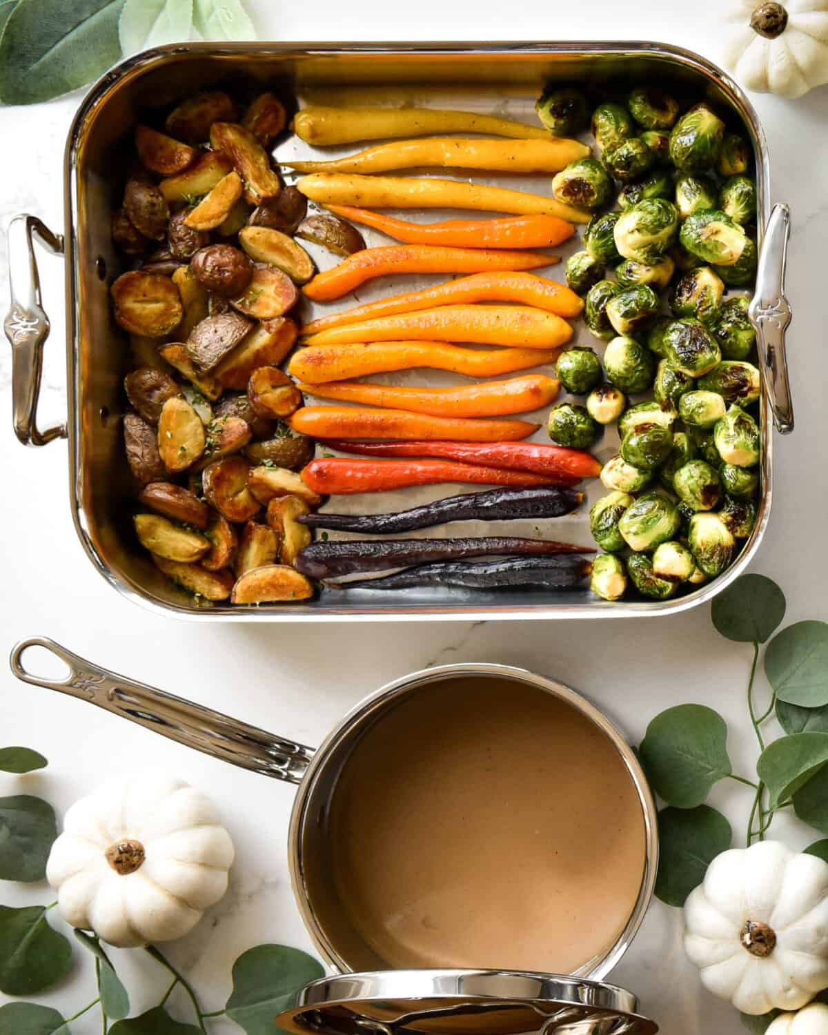 Roasted potatoes, carrrots, brussel sprouts and gravy.
