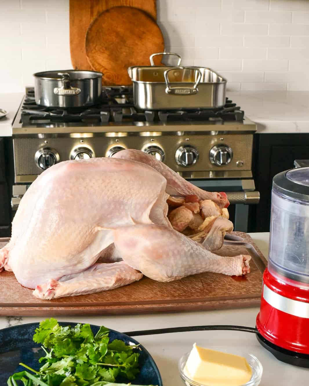 A turkey getting ready to go into the roaster.