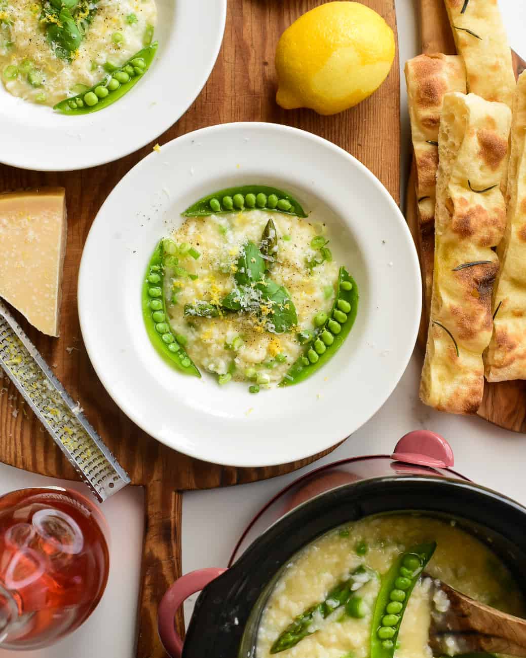 A close up of a bowl of asparagus and pea risotto.