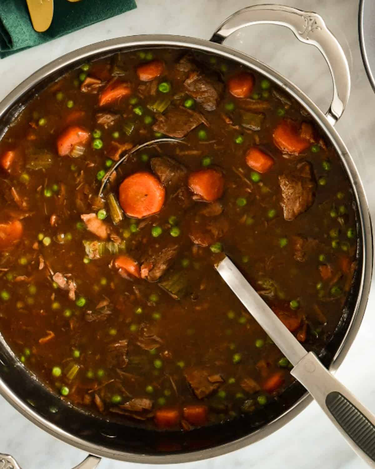 Bring the Guinness stew to a low boil and cook until stew has slightly thickened.