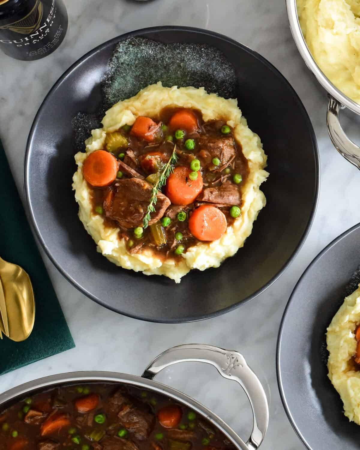 Guinness and Beef Stew served over mashed potatoes.