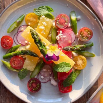 An elegant compressed watermelon, asparagus, radish and feta salad.