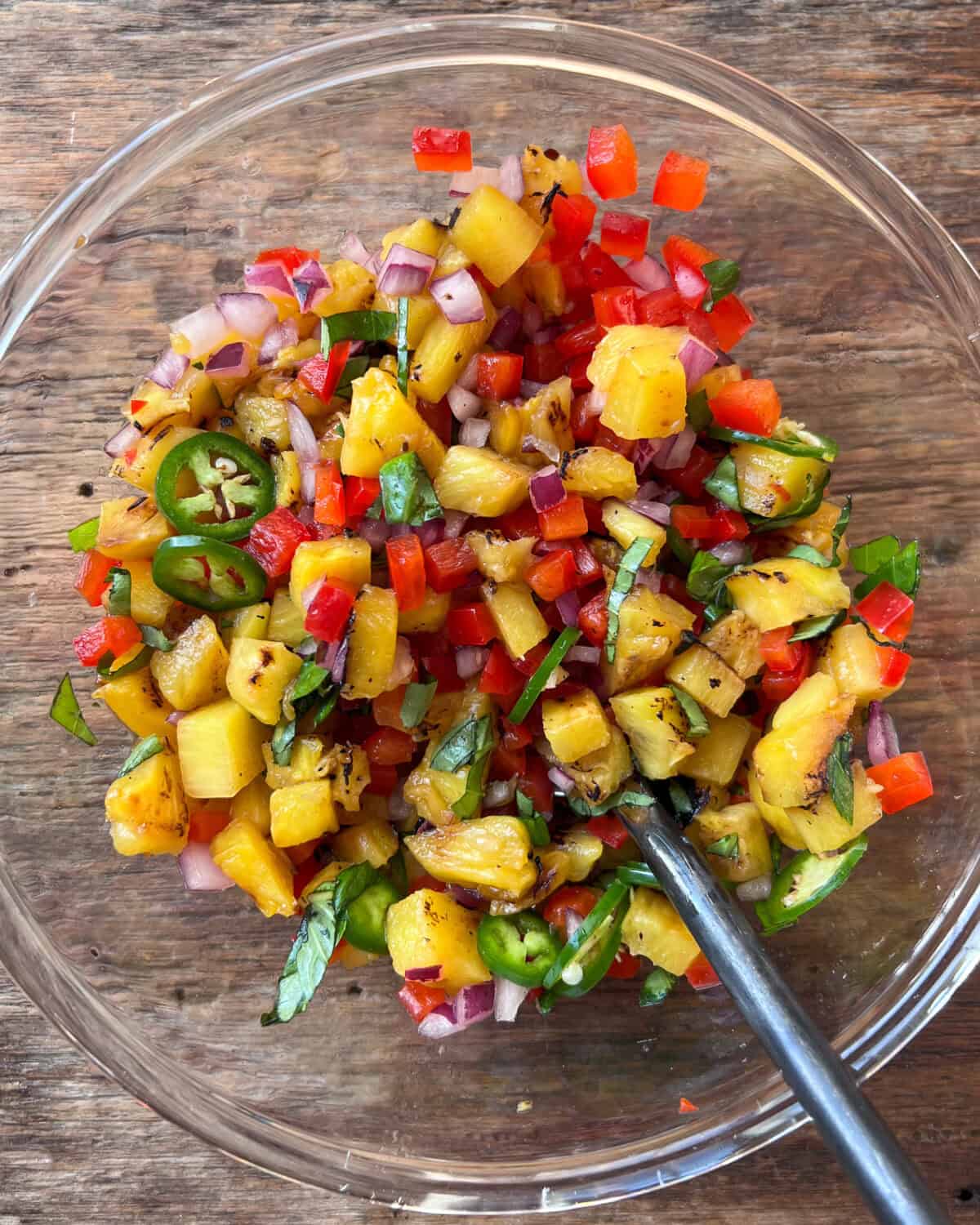 A bowl of pineapple salsa.