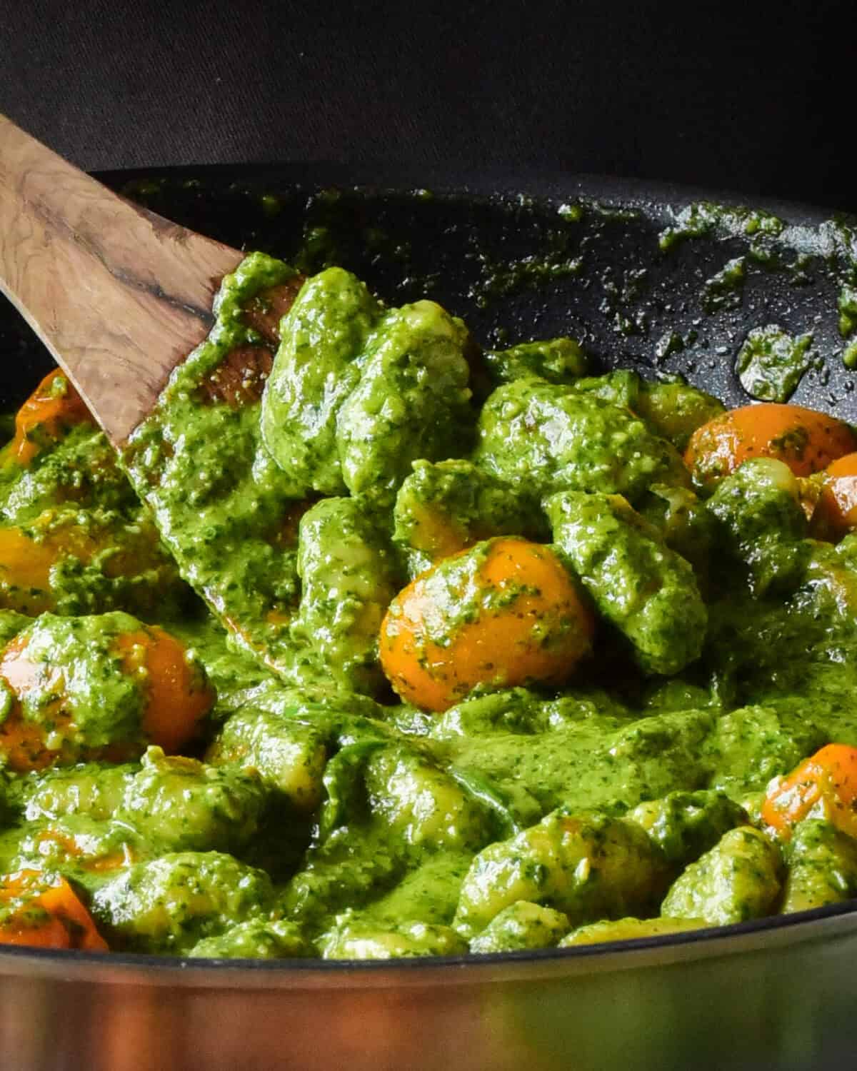 A close up of pan fried pesto gnocchi.
