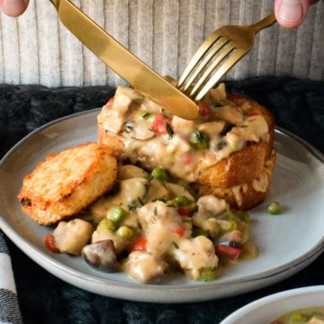 Chicken a la king over toast cups.