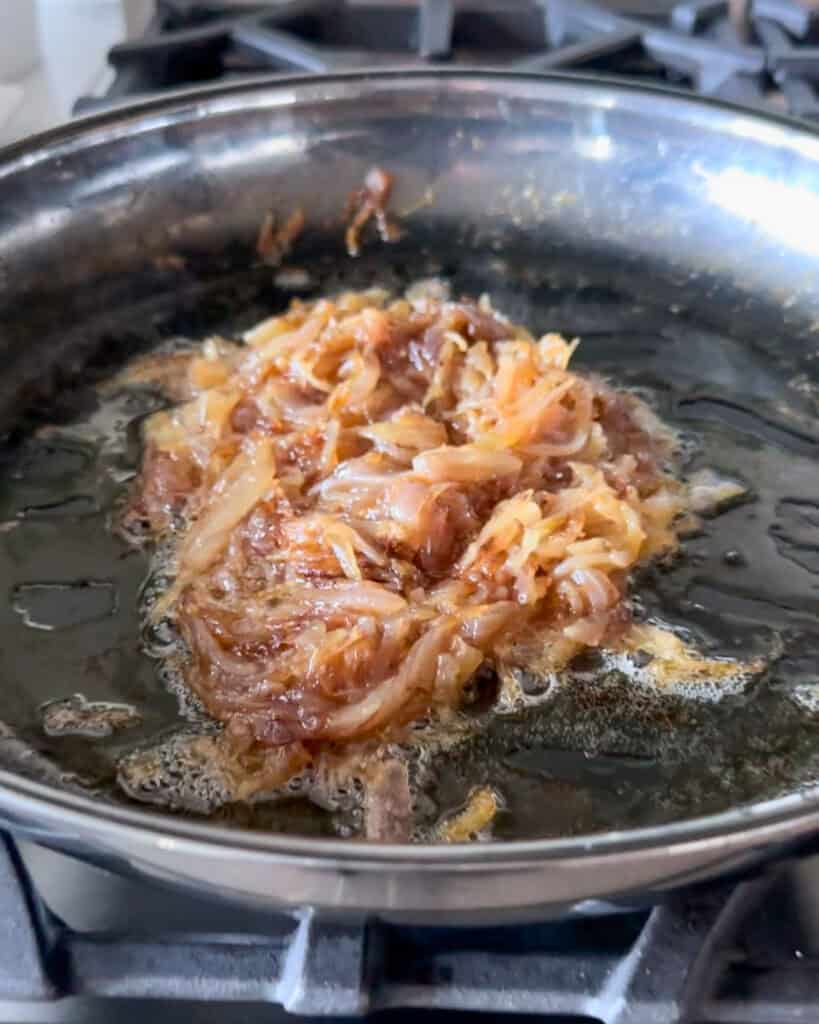 A skilled with caramelized onions.