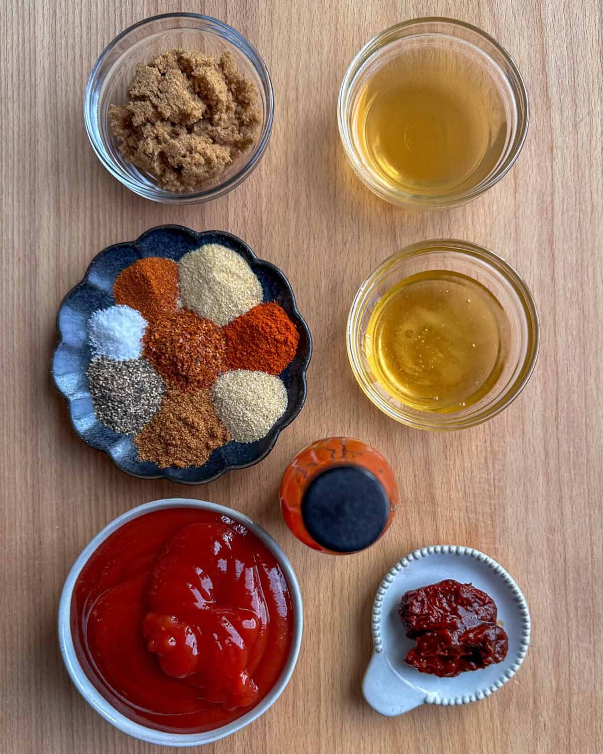 Ingredients measured out for a spicy BBQ chicken sauce recipe.