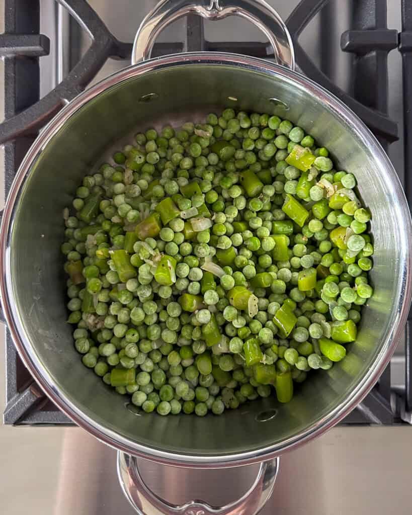 Add the peas, asparagus into the pot.