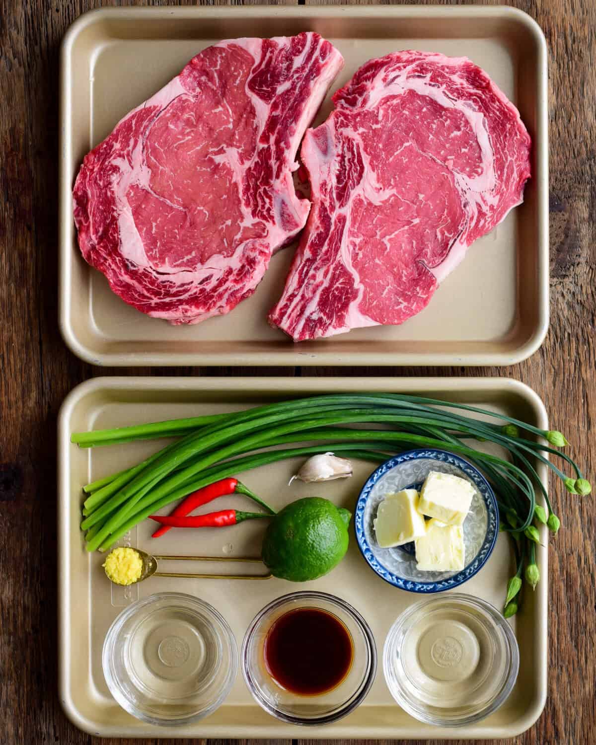 Ingredients laid out for a grilled rib eye steak recipe.
