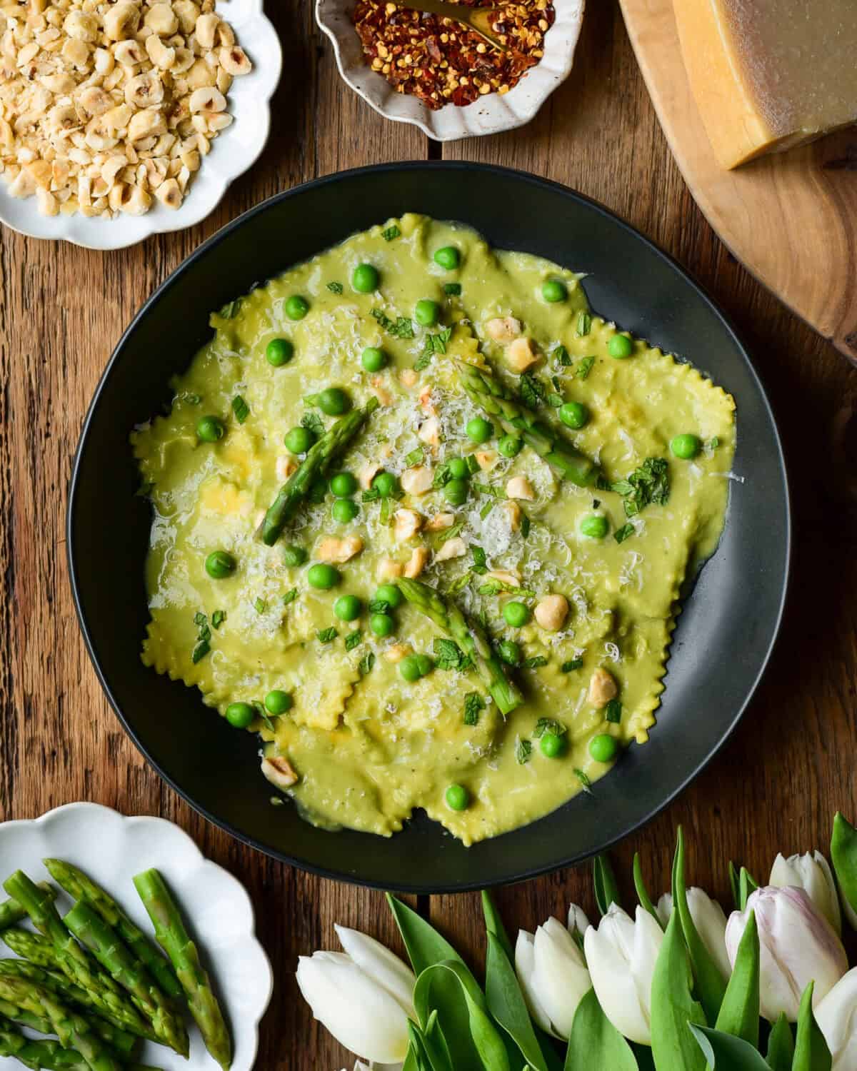 Four Cheese Ravioli served with a homemade pea and asparagus soup/sauce.