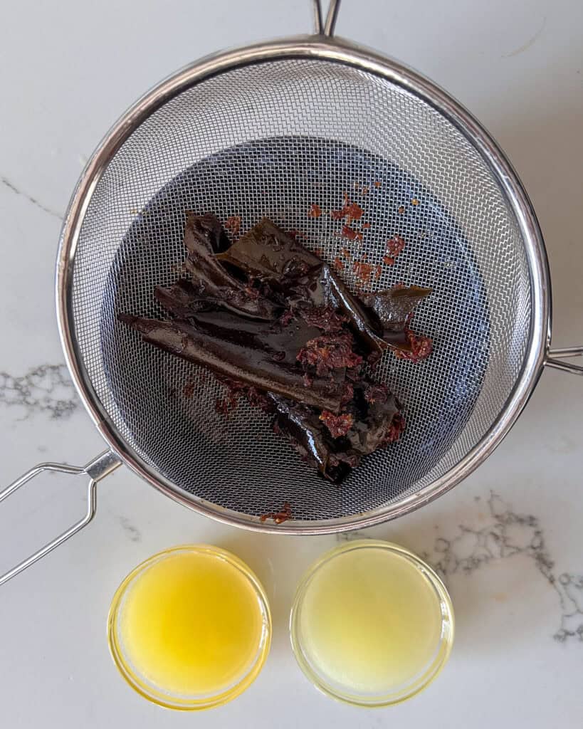 Pour the liquid through a fine mesh strainer to remove all of the solids. Then stir in the lemon and lime juices.