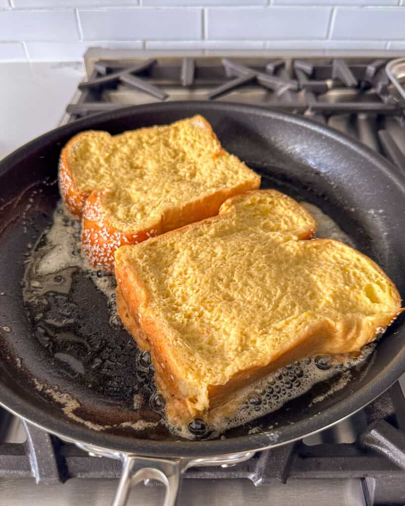 Place 2 pieces of the soaked challah in the skillet and cook each side until golden brown, 3-4 minutes per side.