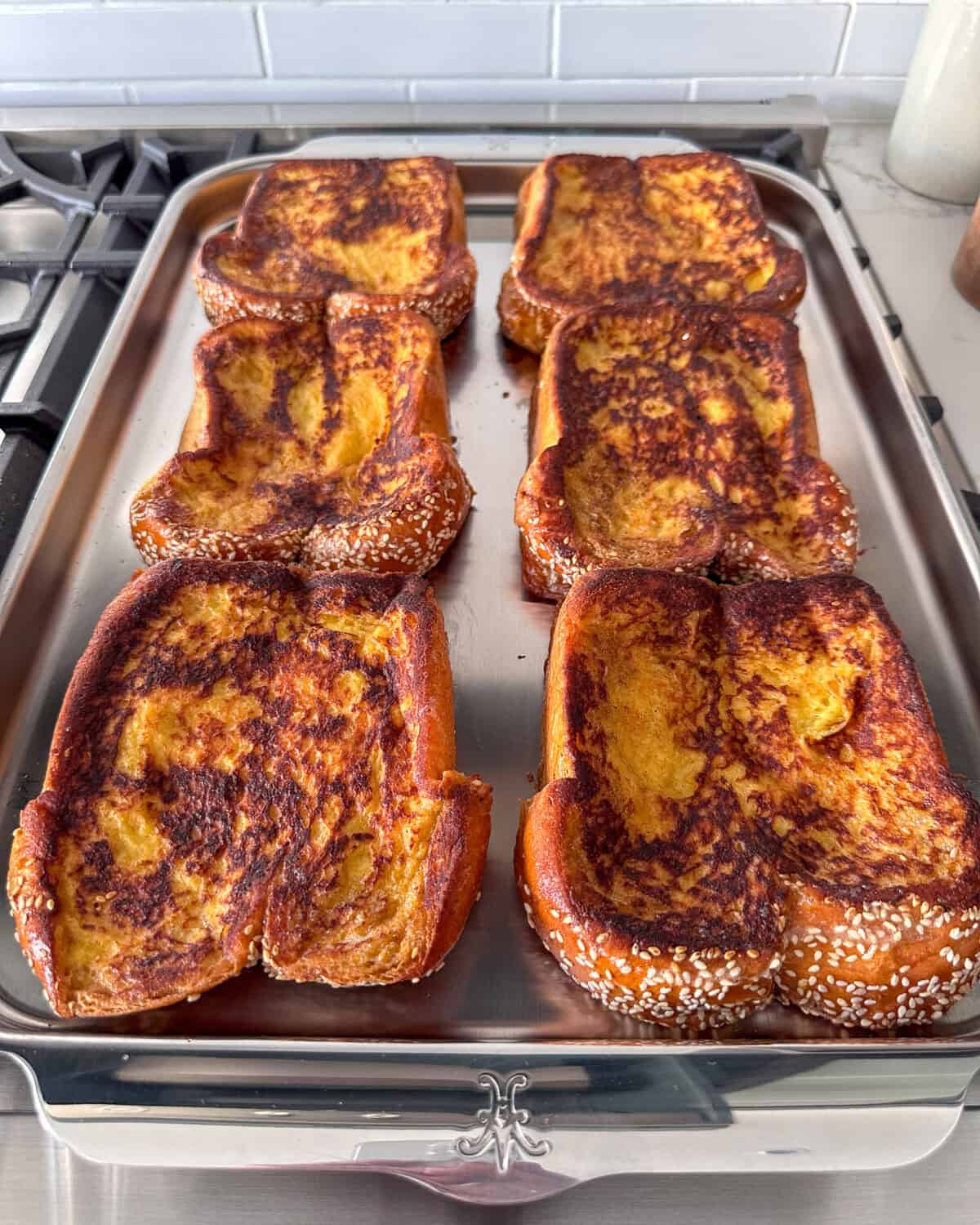 When finished, place on a sheet pan and repeat the process until all the French toast is golden brown.