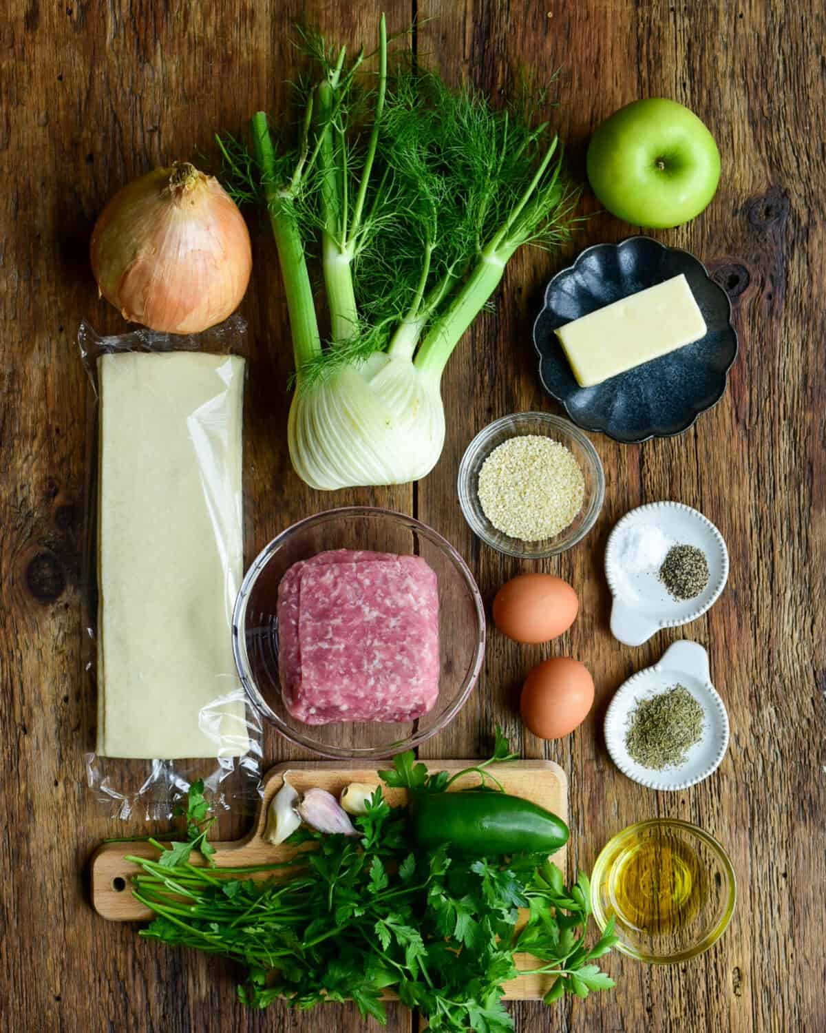 Ingredients laid out for a pork and apple sausage roll recipe.