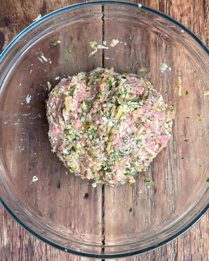 The pork, fennel and apple mixture in a bowl.