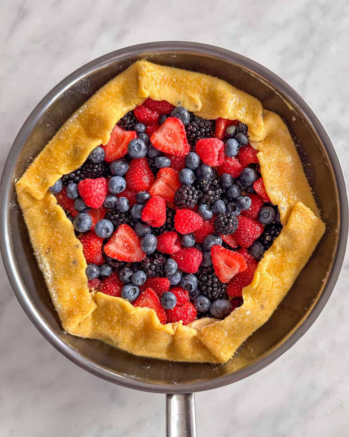 A mixed berry galette ready to grill.