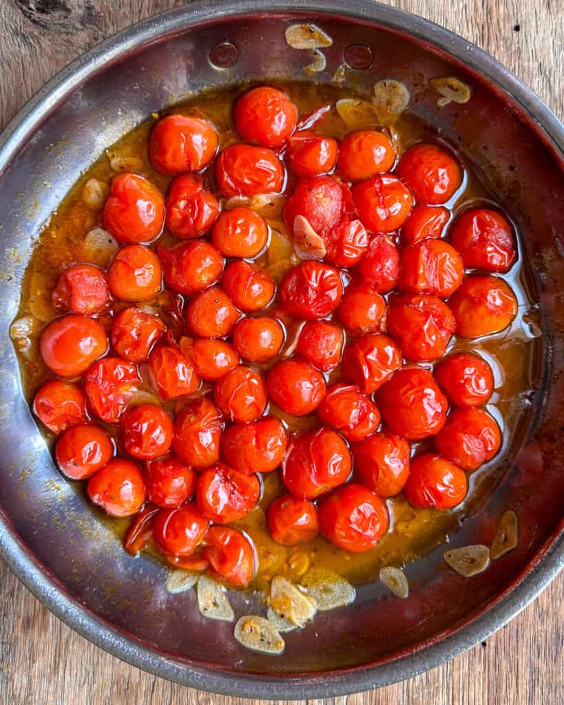 Blistered tomotoes in olive oil and sliced garlic.