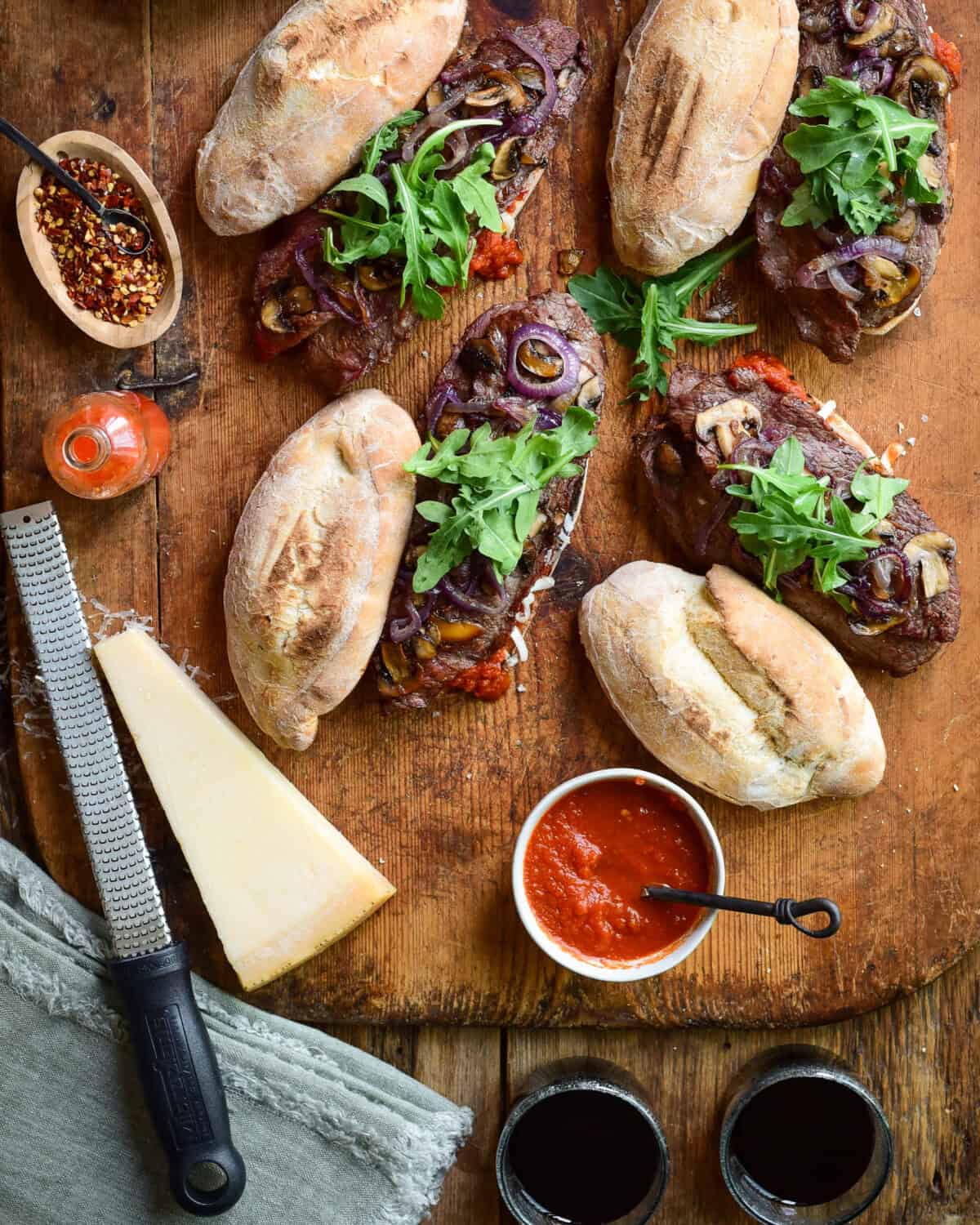 Veal sandwickes served with extra tomato sauce and parma on the side.