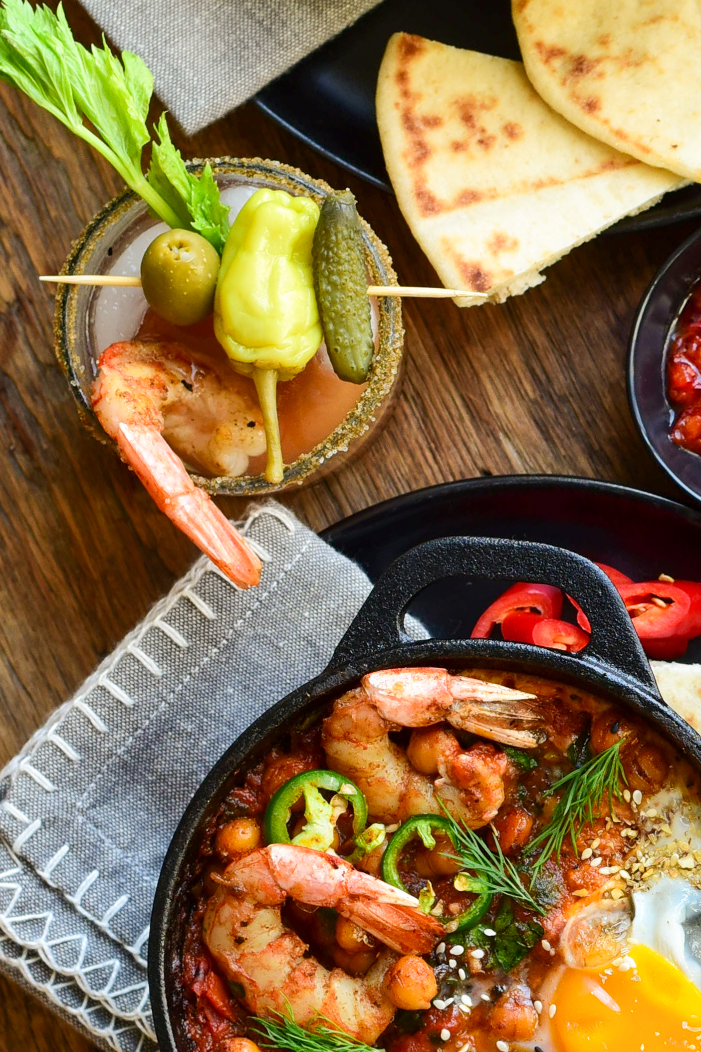 Shrimp Shakshuka served with a mini bloody mary with pickle juice.